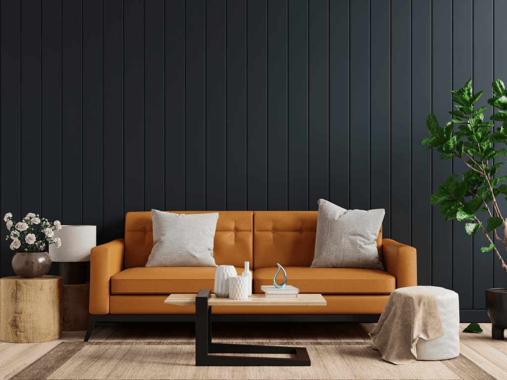 An inviting guest lounge with an orange sofa